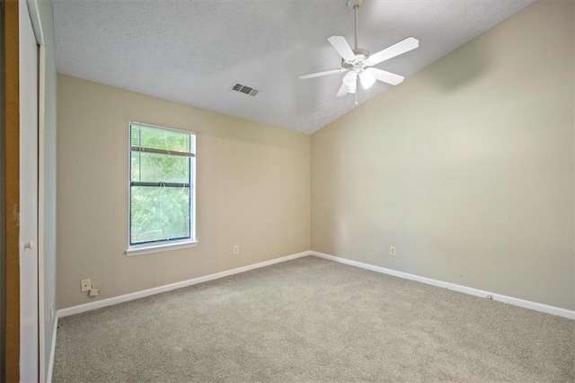 5426 Martins Crossing Rd, Stone Mountain, GA 30088 - unfurnished room featuring carpet flooring, lofted ceiling, ceiling fan, and a textured ceiling