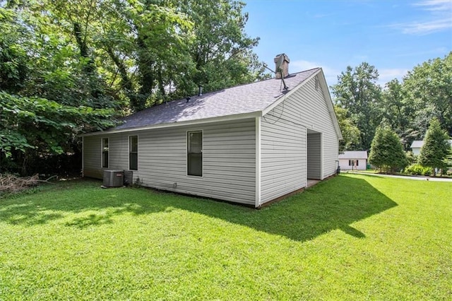 5426 Martins Crossing Rd, Stone Mountain, GA 30088 - view of home's exterior featuring a lawn, a chimney, and roof with shingles