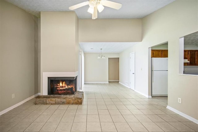 5426 Martins Crossing Rd, Stone Mountain, GA 30088 - unfurnished living room featuring a ceiling fan, a lit fireplace, light tile patterned floors, and a high ceiling