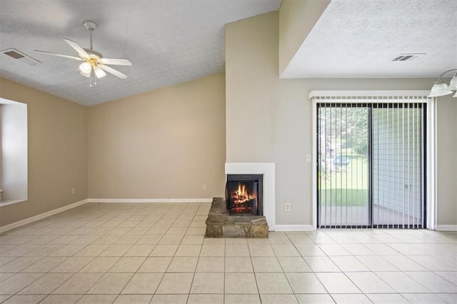 5426 Martins Crossing Rd, Stone Mountain, GA 30088 - unfurnished living room featuring a textured ceiling, a fireplace, light tile patterned floors, and ceiling fan