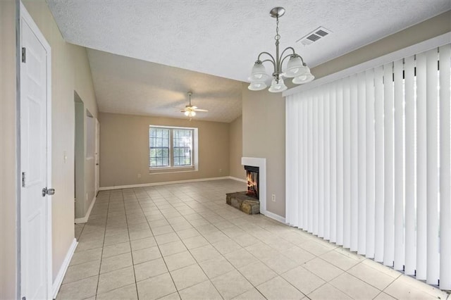 5426 Martins Crossing Rd, Stone Mountain, GA 30088 - unfurnished living room featuring light tile patterned floors, a chandelier, a warm lit fireplace, a textured ceiling, and a ceiling fan