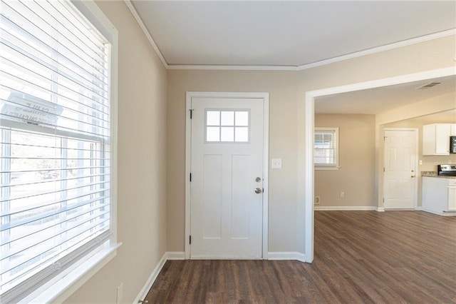 foyer entrance featuring dark hardwood / wood-style floors and ornamental molding