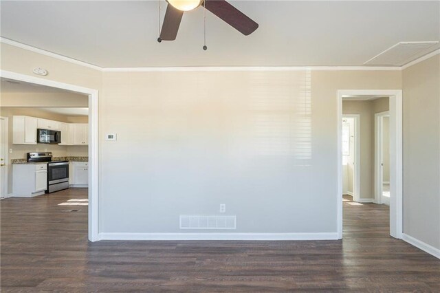 empty room with dark hardwood / wood-style floors, ceiling fan, and ornamental molding