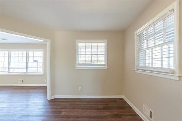 empty room featuring dark wood-type flooring