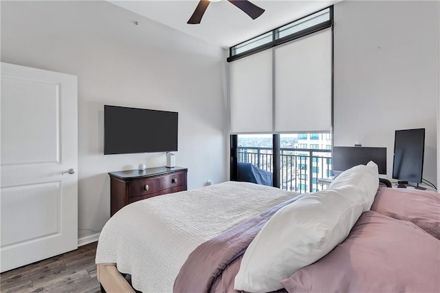 bedroom featuring a ceiling fan and wood finished floors