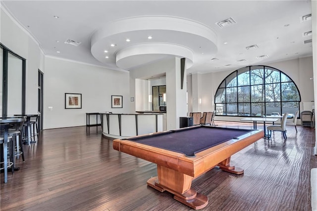 game room featuring visible vents, crown molding, and wood finished floors