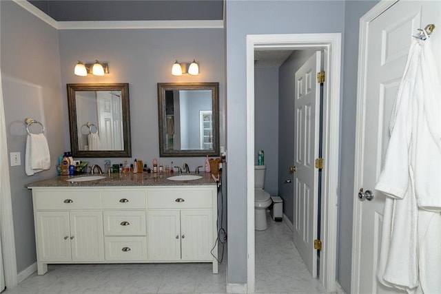 8601 Flint Hill Rd, Douglasville, GA 30135 - bathroom with toilet, double vanity, baseboards, and marble look tiles