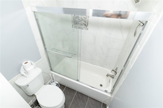 8601 Flint Hill Rd, Douglasville, GA 30135 - bathroom featuring bath / shower combo with glass door and toilet