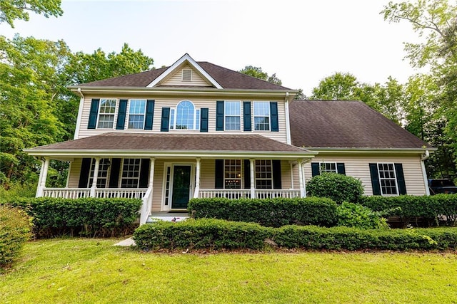 8601 Flint Hill Rd, Douglasville, GA 30135 - colonial home featuring a front lawn and a porch
