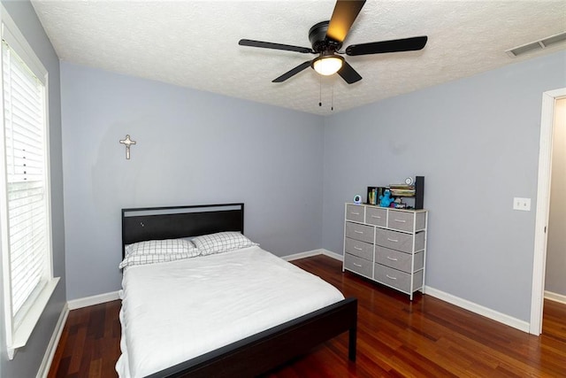 8601 Flint Hill Rd, Douglasville, GA 30135 - bedroom featuring a textured ceiling, wood finished floors, baseboards, and ceiling fan