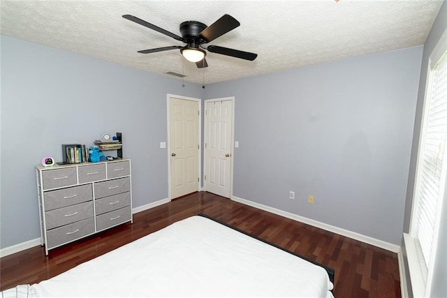 8601 Flint Hill Rd, Douglasville, GA 30135 - unfurnished bedroom with wood finished floors, baseboards, a textured ceiling, and ceiling fan