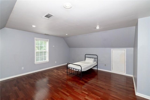 8601 Flint Hill Rd, Douglasville, GA 30135 - bedroom with vaulted ceiling, wood finished floors, baseboards, and recessed lighting