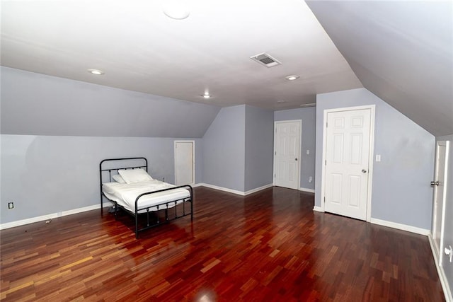 8601 Flint Hill Rd, Douglasville, GA 30135 - bedroom with vaulted ceiling, wood finished floors, baseboards, and recessed lighting