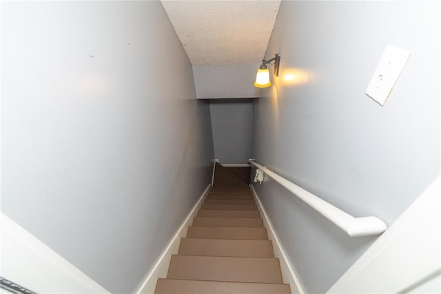 8601 Flint Hill Rd, Douglasville, GA 30135 - staircase with a textured ceiling