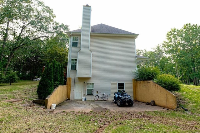 8601 Flint Hill Rd, Douglasville, GA 30135 - rear view of property featuring a patio and a chimney