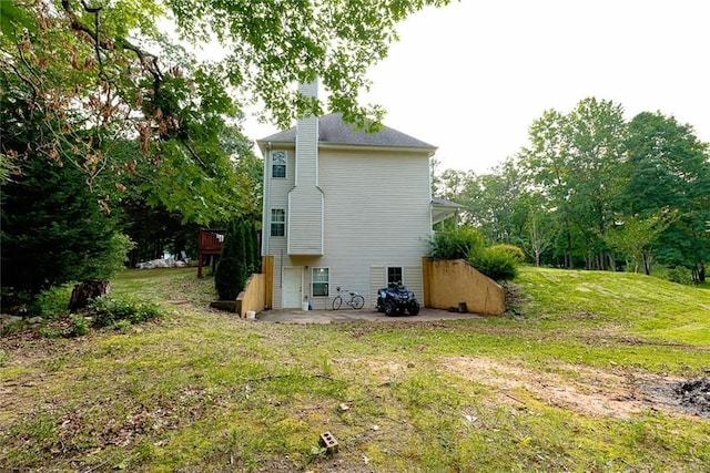 8601 Flint Hill Rd, Douglasville, GA 30135 - back of property featuring a patio and a lawn