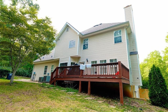 8601 Flint Hill Rd, Douglasville, GA 30135 - rear view of house featuring a deck, a chimney, cooling unit, and a yard