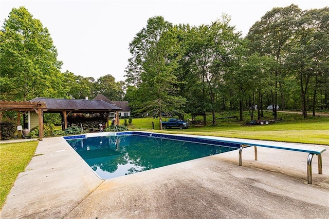 8601 Flint Hill Rd, Douglasville, GA 30135 - swimming pool featuring a yard, a diving board, a patio, and view of wooded area