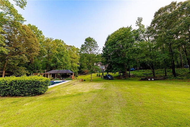 8601 Flint Hill Rd, Douglasville, GA 30135 - view of grassy yard with an outdoor pool and a gazebo