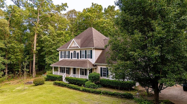 8601 Flint Hill Rd, Douglasville, GA 30135 - view of front facade with a porch and a front lawn