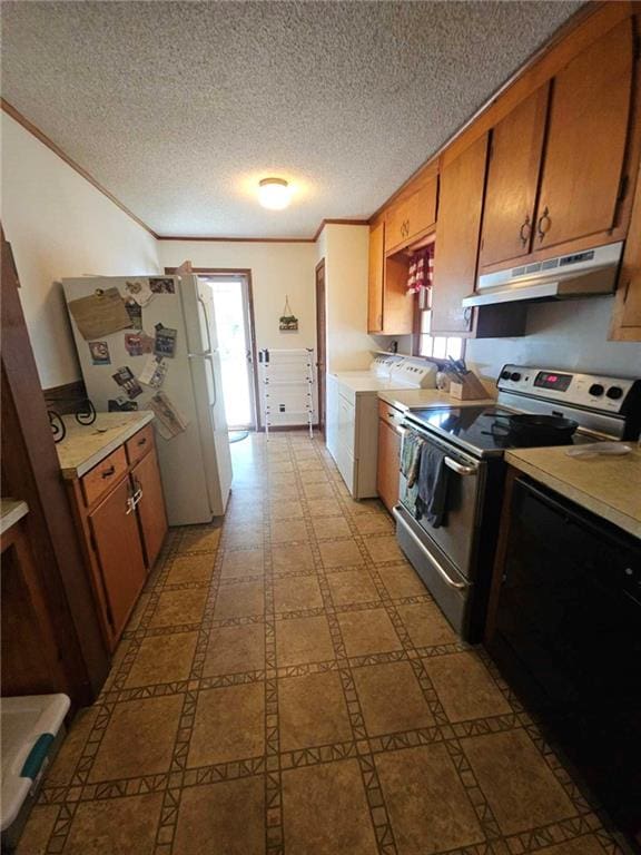 kitchen featuring washer / clothes dryer, white refrigerator, a textured ceiling, stainless steel electric range oven, and ornamental molding