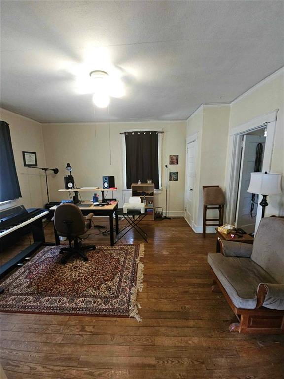 interior space with ceiling fan and dark hardwood / wood-style floors