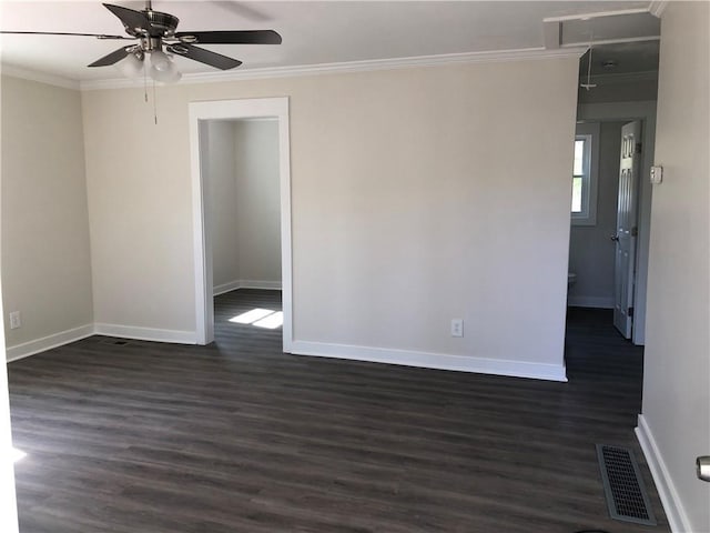 unfurnished room with ceiling fan, visible vents, ornamental molding, and baseboards