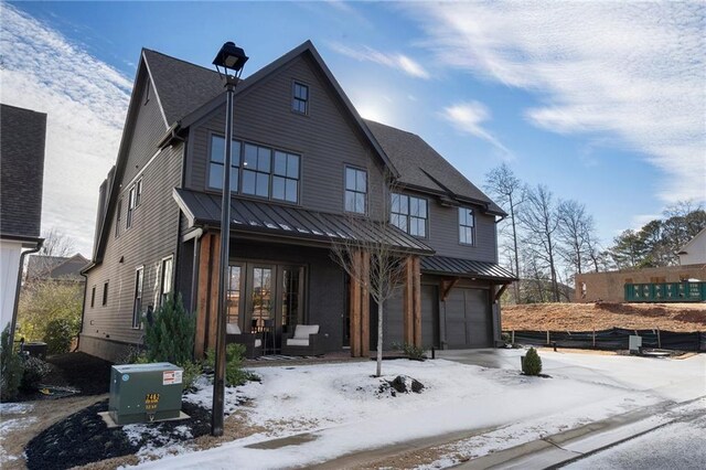 view of front of house with a garage and covered porch