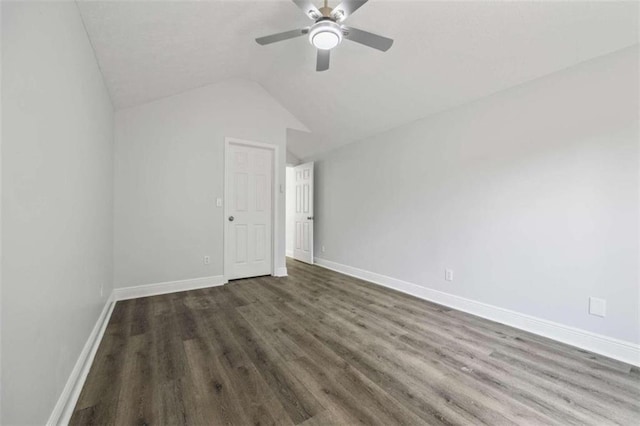 unfurnished bedroom with ceiling fan, vaulted ceiling, and wood-type flooring