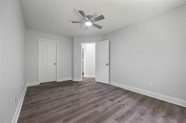 unfurnished bedroom with ceiling fan and hardwood / wood-style floors