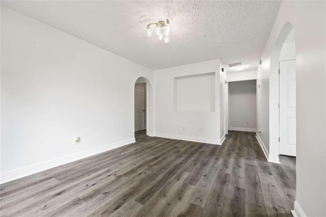 interior space with a textured ceiling and hardwood / wood-style flooring