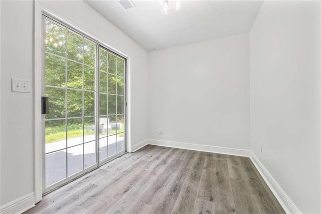 spare room featuring light wood-type flooring