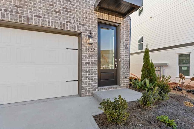 doorway to property featuring a garage