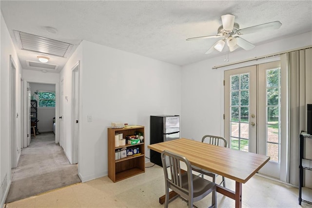 4051 Dixie Ln, Douglasville, GA 30135 - dining area featuring plenty of natural light, light floors, french doors, a ceiling fan, and a textured ceiling
