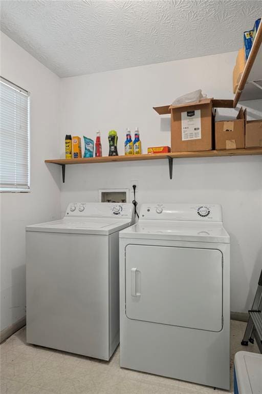 4051 Dixie Ln, Douglasville, GA 30135 - laundry area featuring independent washer and dryer and a textured ceiling