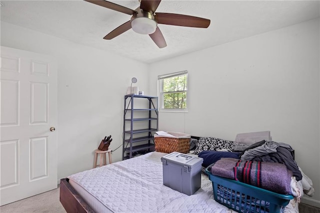 4051 Dixie Ln, Douglasville, GA 30135 - carpeted bedroom featuring a ceiling fan and a textured ceiling
