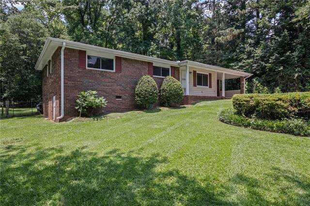 4051 Dixie Ln, Douglasville, GA 30135 - ranch-style home with a front lawn, brick siding, and crawl space