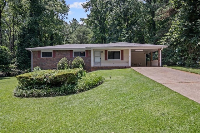 4051 Dixie Ln, Douglasville, GA 30135 - ranch-style home featuring concrete driveway, an attached carport, a front yard, and brick siding