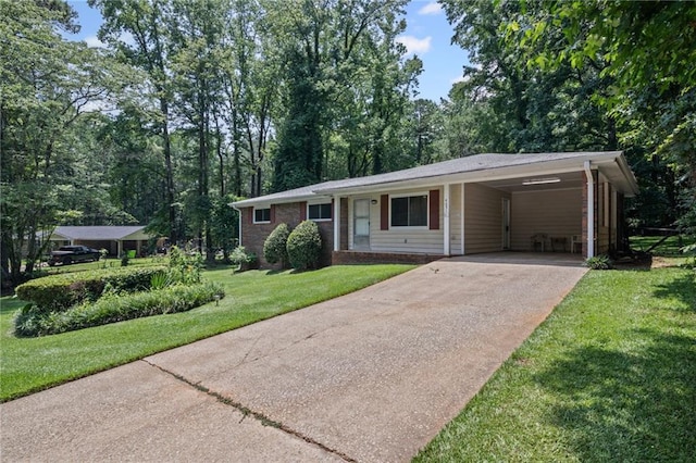 4051 Dixie Ln, Douglasville, GA 30135 - single story home with driveway, a front lawn, and a carport