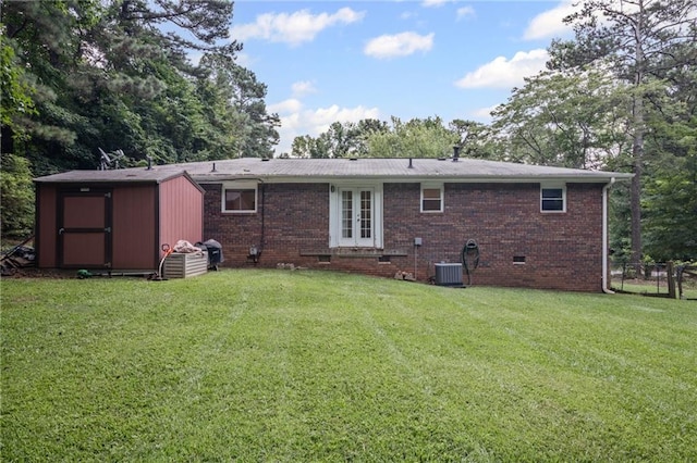 4051 Dixie Ln, Douglasville, GA 30135 - back of house featuring crawl space, french doors, a storage unit, and brick siding