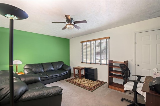 4051 Dixie Ln, Douglasville, GA 30135 - carpeted living area featuring a ceiling fan and a textured ceiling