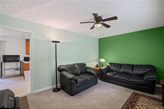 4051 Dixie Ln, Douglasville, GA 30135 - living area with a ceiling fan, carpet floors, and a textured ceiling