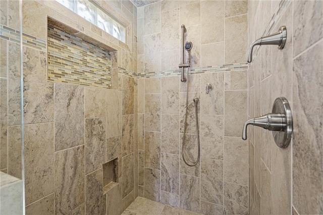 bathroom featuring tiled shower