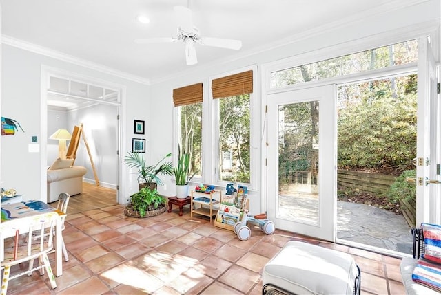 sunroom / solarium featuring ceiling fan