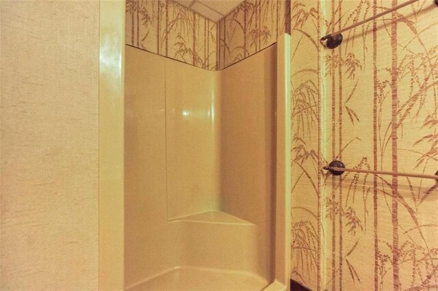 bathroom featuring vanity, a shower with shower door, ornamental molding, and toilet