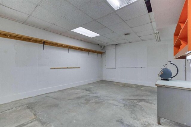 interior space with wooden walls and a textured ceiling