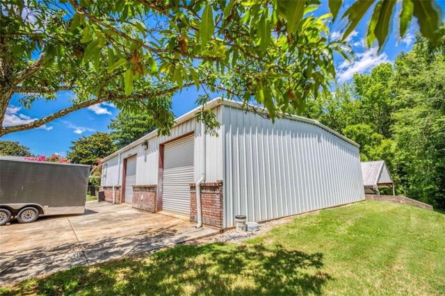 view of yard with an outbuilding and a patio area