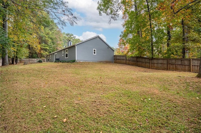 view of yard with a fenced backyard