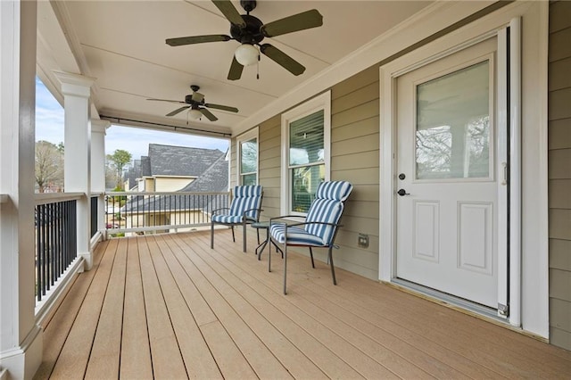 deck with a porch and ceiling fan