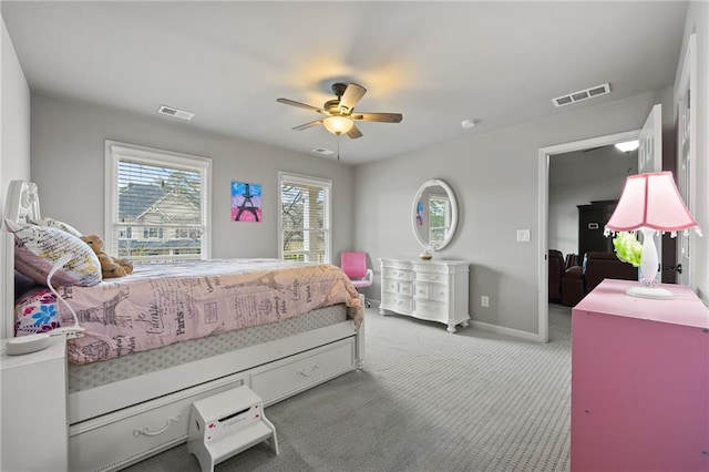 bedroom featuring visible vents, carpet floors, baseboards, and a ceiling fan